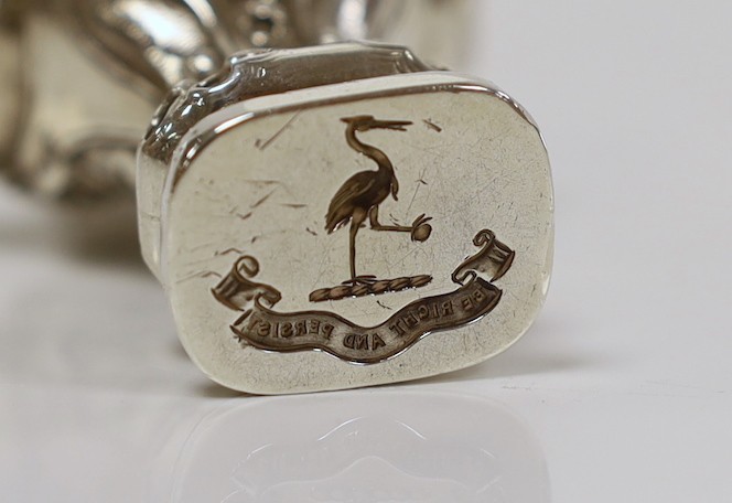 An early 20th century Art Nouveau silver seal, modelled as the bust of a lady, import marks for Berthold Muller, Chester, 1901, height 93mm, the matrix carved with family crest.